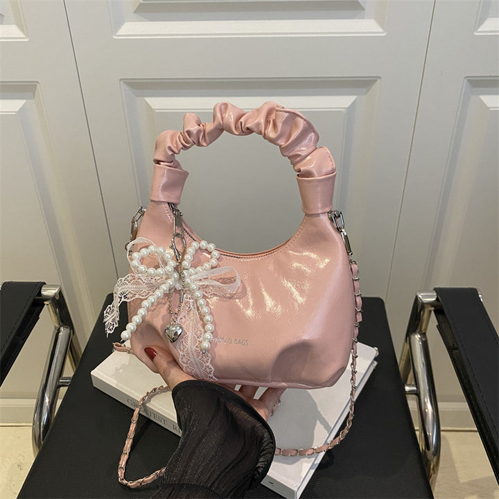 Damen elegante Handtasche mit dekorativen Perlenakzenten Nord Taschen