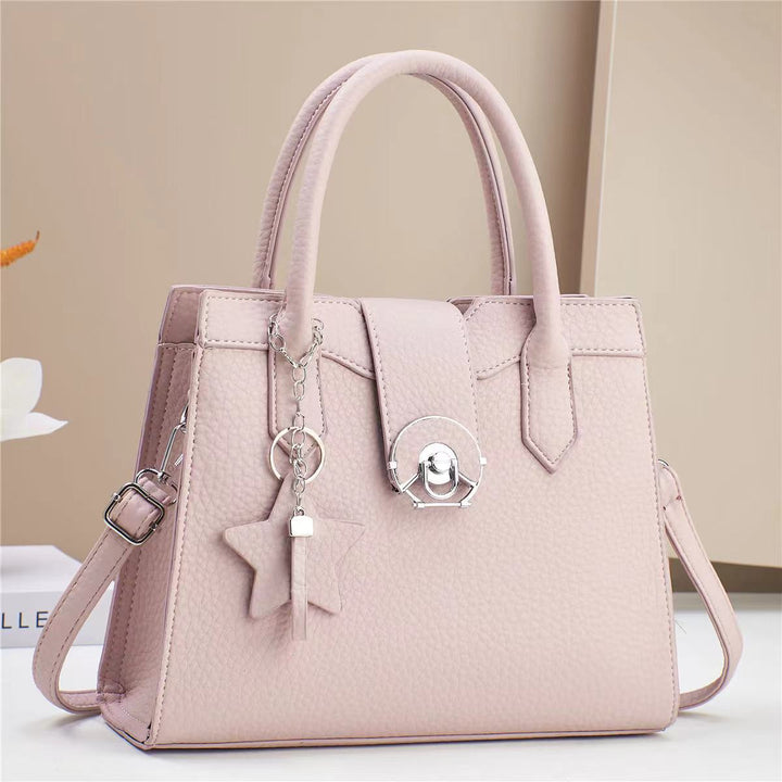 Damen elegante Handtasche mit modischem Anhänger Nord Taschen