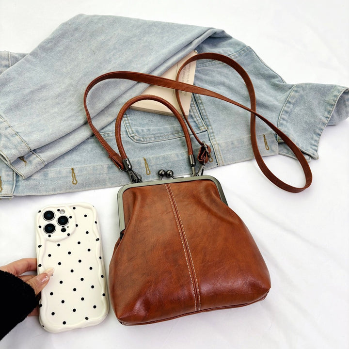 Damen elegante Handtasche mit robustem Metallverschluss Nord Taschen