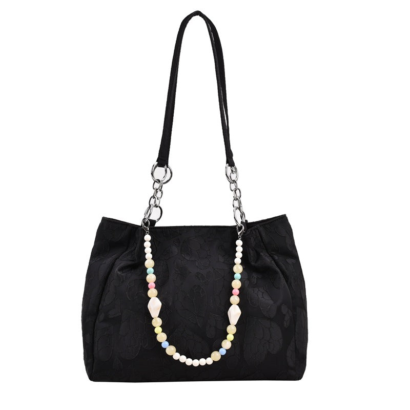Damen modische Handtasche mit Herzprägung und buntem Anhänger Nord Taschen