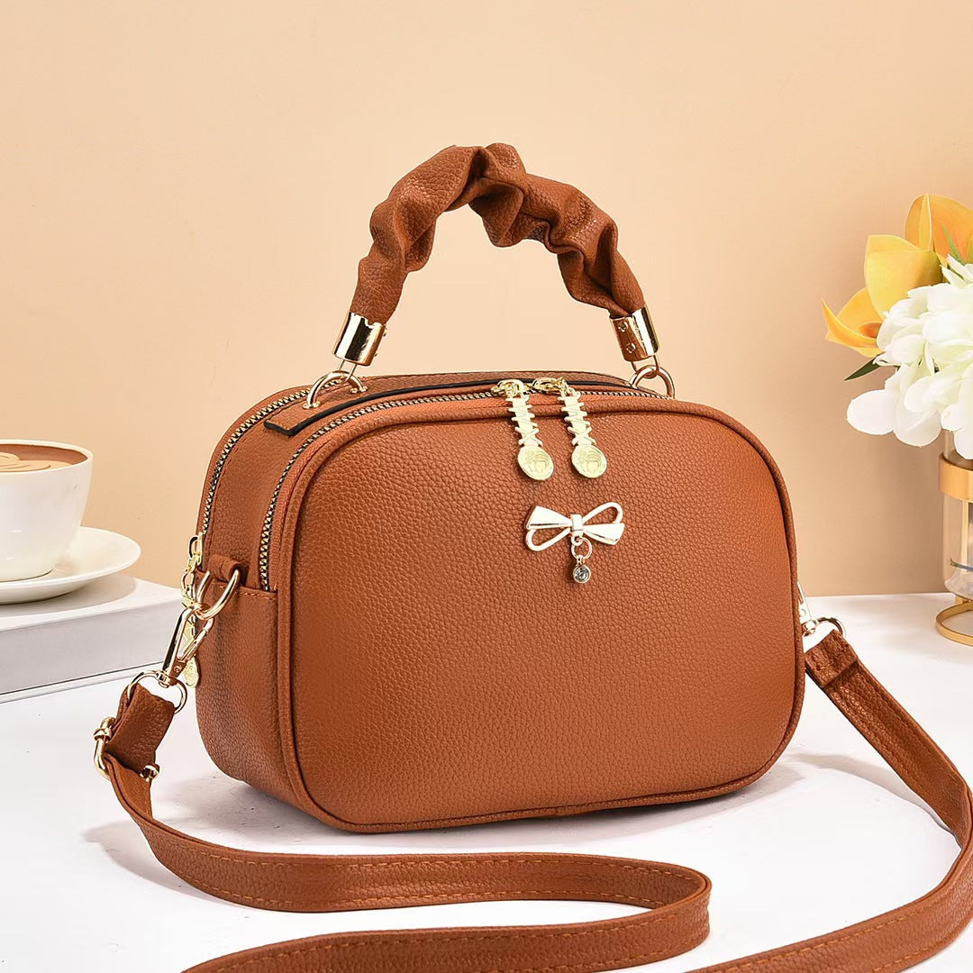 Damen Handtasche mit geflochtenem Tragegriff und edlem Zipper Nord Taschen