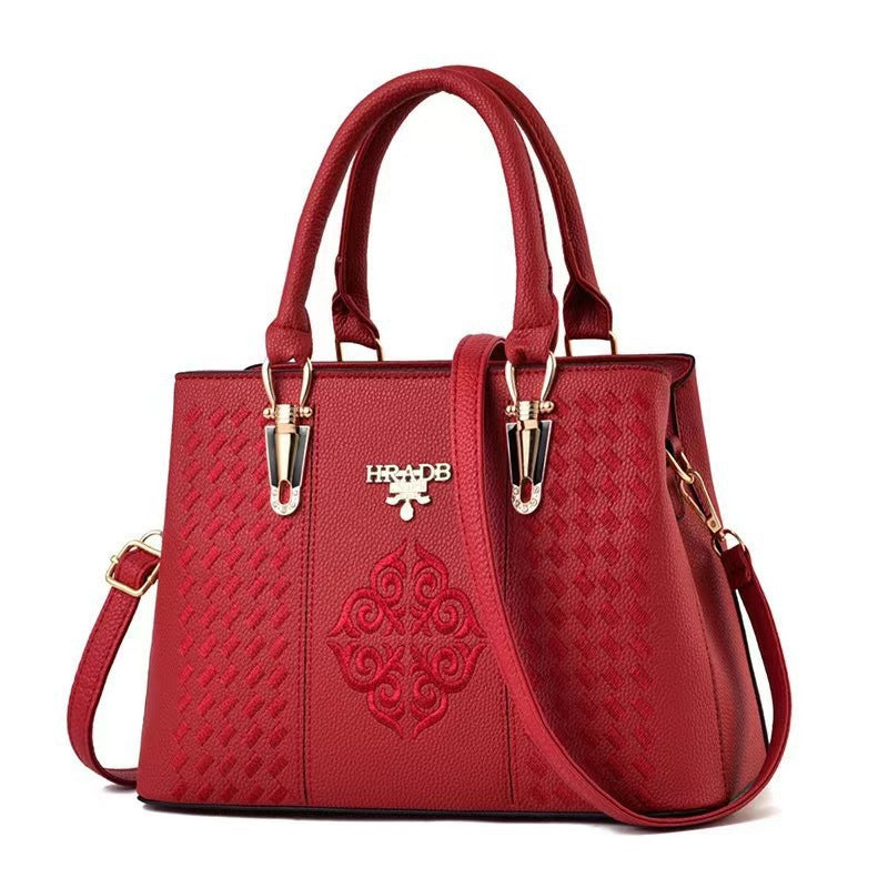 Damen elegante Handtasche mit aufwendigem gewebtem Design und kontrastierender Verzierung Nord Taschen
