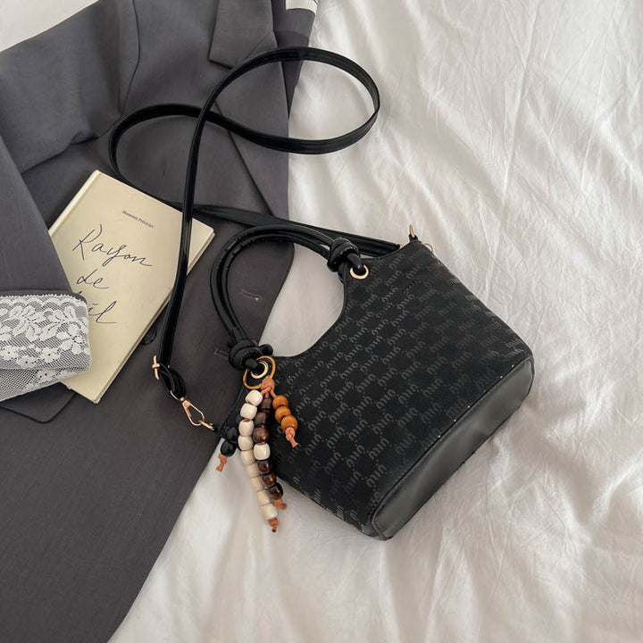 Damen Mini-Handtasche mit schimmerndem Obermaterial und eleganten Accessoires Nord Taschen