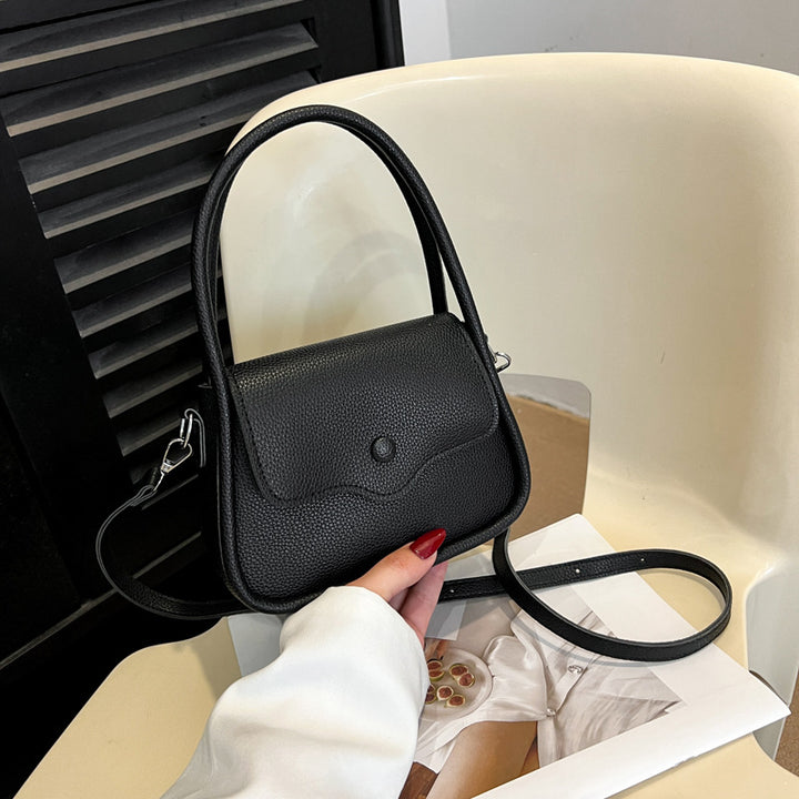Damen Ledertasche mit dekorativer Klappenöffnung Nord Taschen