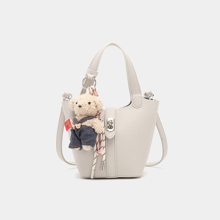 Damen Handtasche mit abnehmbarem Kuscheltier-Anhänger und elegantem Design Nord Taschen