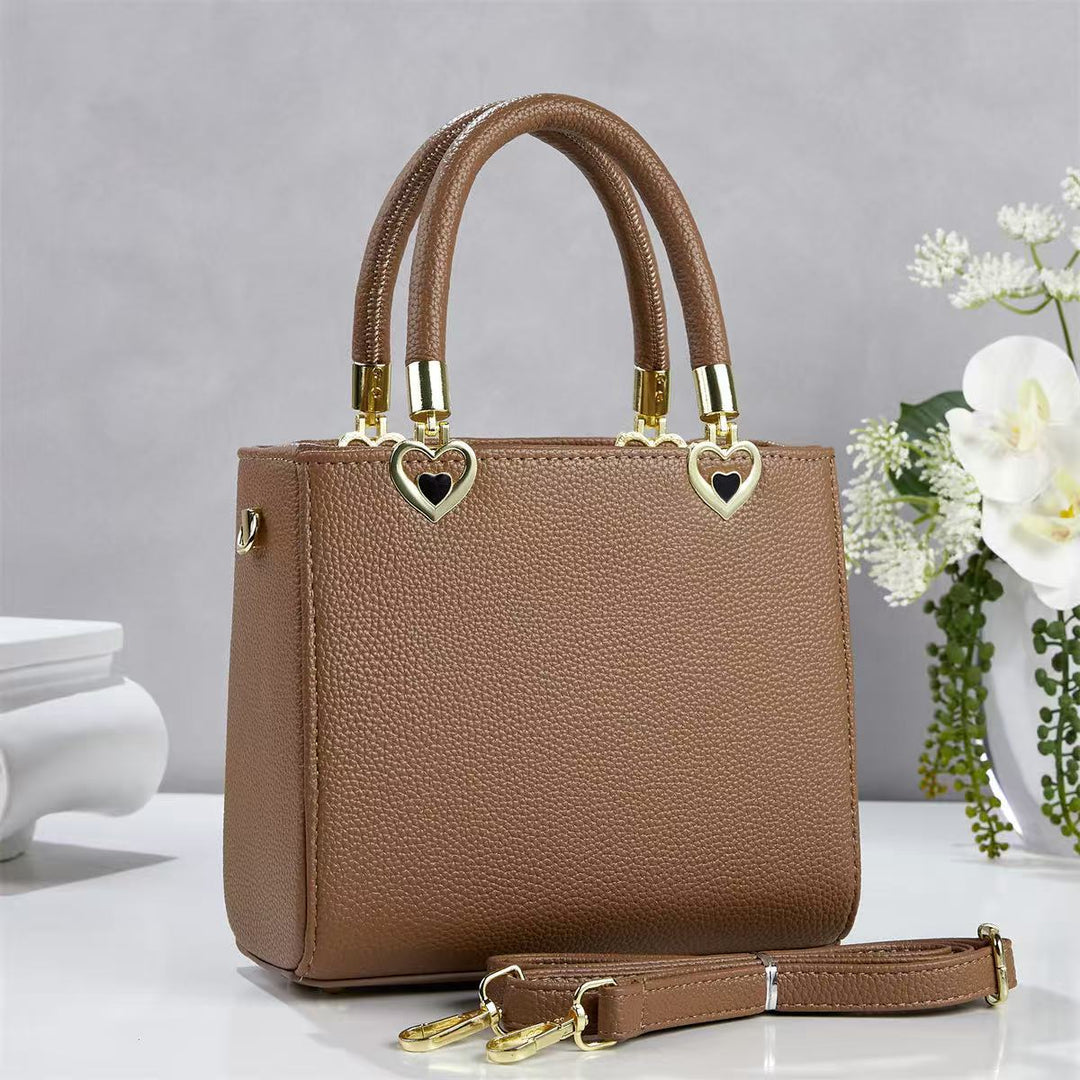 Damen stylische Handtasche mit schimmernden Herzanhängern Nord Taschen