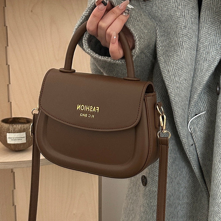 Damen Henkeltasche mit modernem Klappverschluss und eleganten Details Nord Taschen