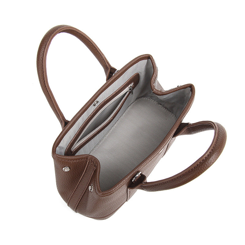 Damen Handtasche mit abnehmbarem Elefantenanhänger und elegantem Kunstleder Nord Taschen