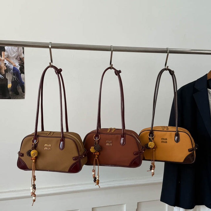 Damen elegante Handtasche mit verspielten Anhängern Nord Taschen