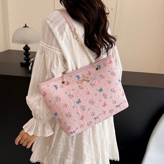 Damen Einkaufstasche mit floralem Design und elegantem Kettenakzent Nord Taschen