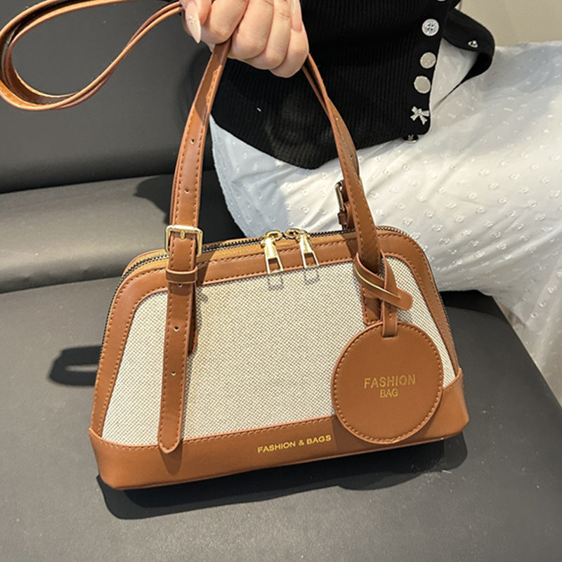 Damen Umhängetasche mit strukturiertem Gewebe und elegantem Detail Nord Taschen