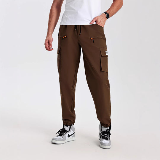 Herren konisch geschnittene Utility-Cargohose im Joggerstil mit Tunnelzugbund, Reißverschlusstaschen & elastischen Beinabschlüssen Nord Taschen