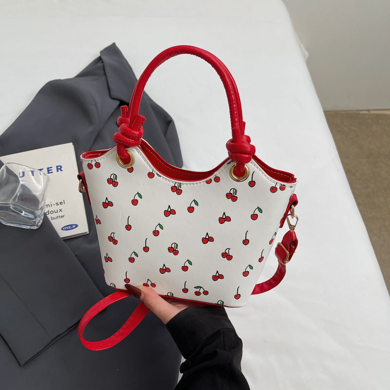 Damen Handtasche mit charmantem Kirschdesign und eleganten Details Nord Taschen