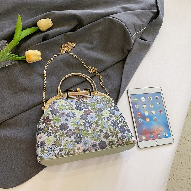 Damen elegante Umhängetasche mit floralen Akzenten und goldenen Verzierungen Nord Taschen