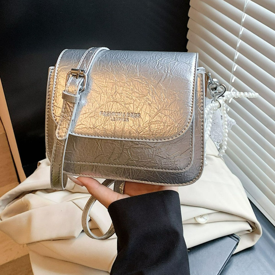 Damen Umhängetasche mit charmantem Spitzen- und Perlenanhänger Nord Taschen