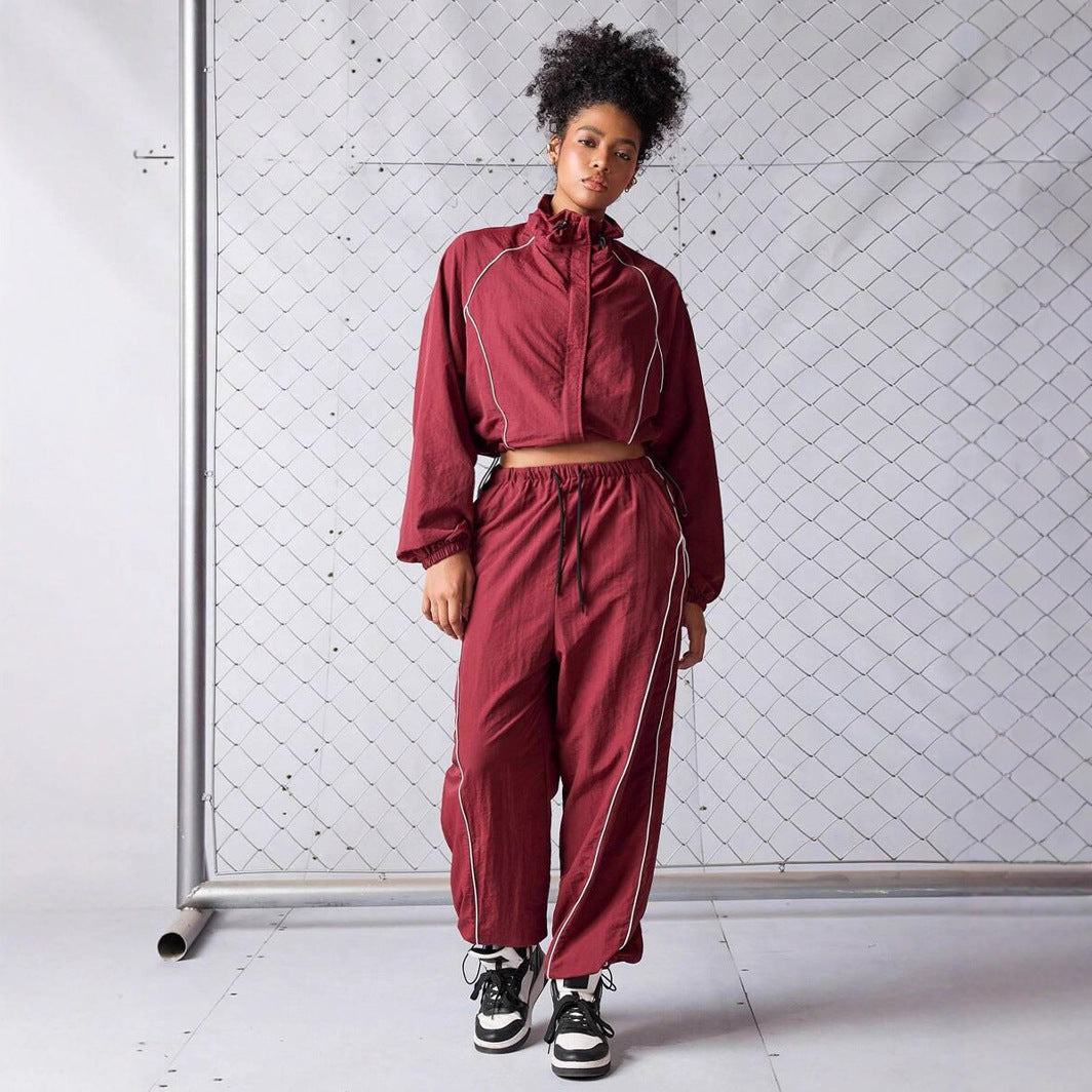 Damen sportives Cropped Windbreaker-Set mit Stehkragen Tunnelzug und reflektierenden Paspeln Nord Taschen