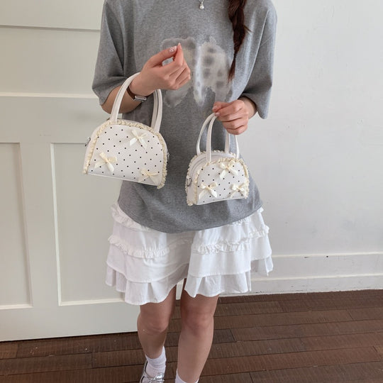 Damen modische Handtasche im verspielt romantischen Design mit Schleifenakzenten Nord Taschen