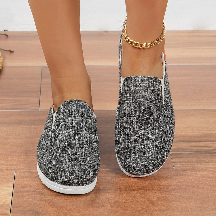 Damen  Slip-On Canvas‑Mules mit Kuhfleckenprint, gepolstertem Komfortfußbett und rutschfester Leichtsohle Nord Taschen