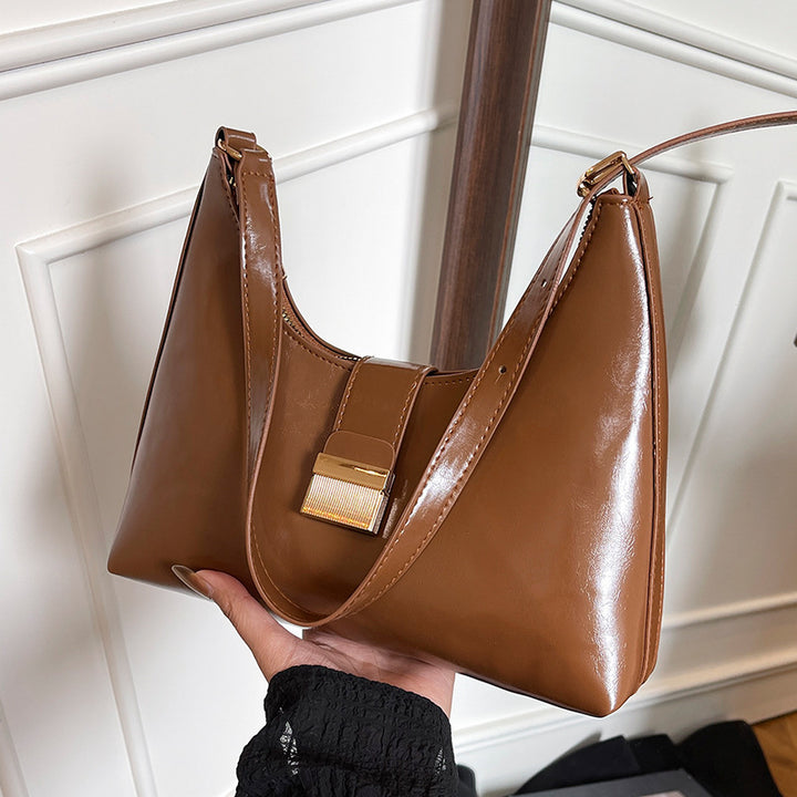 Damen elegante Handtasche mit glänzendem Obermaterial und innovativem Verschluss Nord Taschen