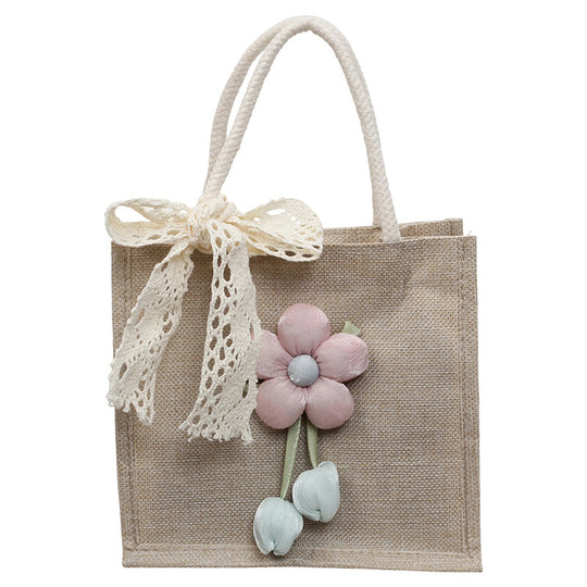 Damen Jute-Handtasche mit floralen Applikationen und dekorativem Schleifen-Design Nord Taschen