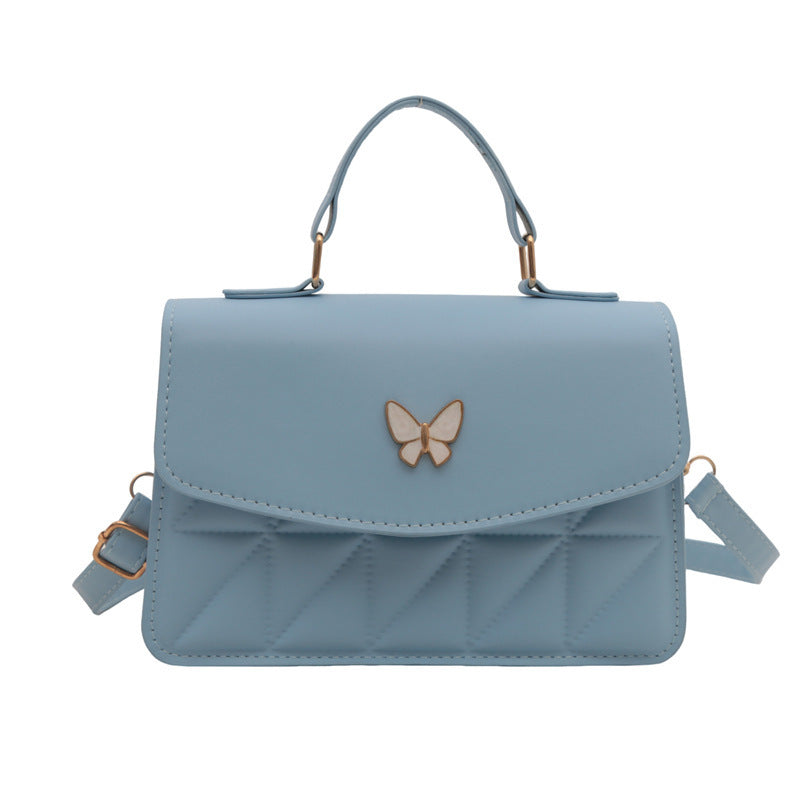 Damen elegante Handtasche mit Quermuster und stylischem Schmetterling Nord Taschen