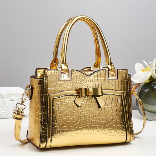 Damen elegante Handtasche mit dekorativem Schleifen-Detail und strukturiertem Krokodil-Leder-Look Nord Taschen