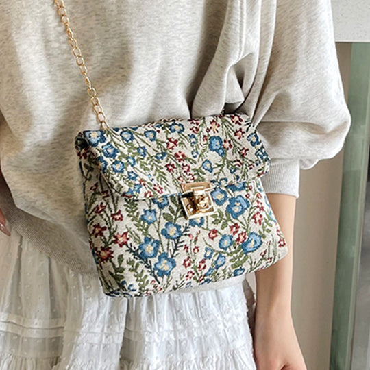 Damen Clutch-Tasche mit floralem Stoffdesign und goldener Kettenverzierung Nord Taschen