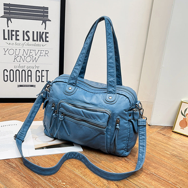 Damen Handtasche mit strukturiertem Design und dekorativen Metallakzenten Nord Taschen