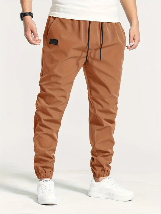 Herren Technische Jogginghose im Tapered‑Utility‑Stil mit elastischem Bund & Knöchelbündchen Nord Taschen
