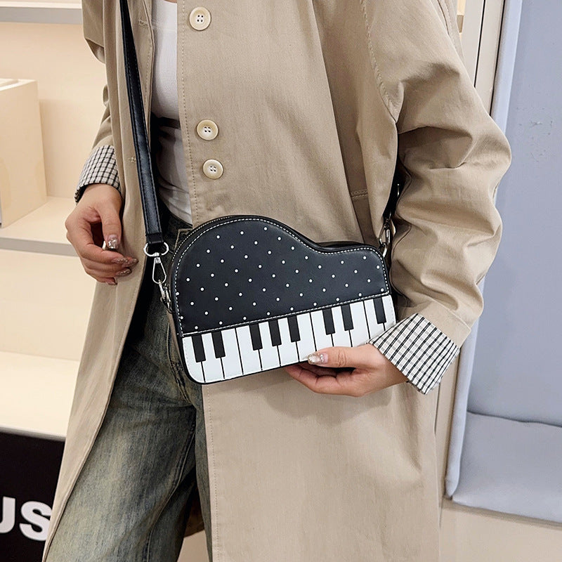 Damen Clutch-Tasche mit verspieltem Klavier-Design Nord Taschen