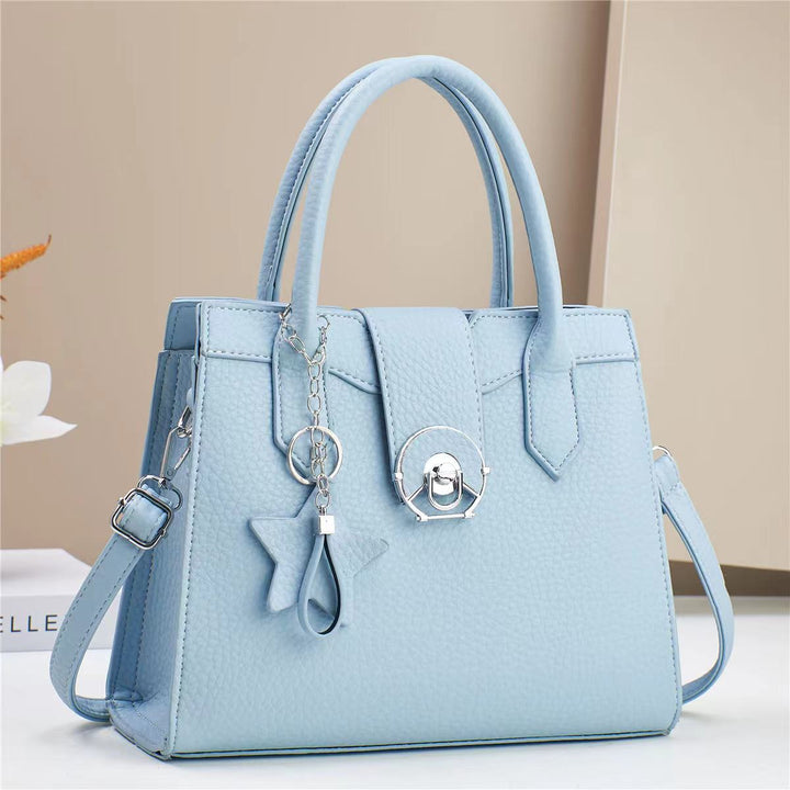 Damen elegante Handtasche mit modischem Anhänger Nord Taschen