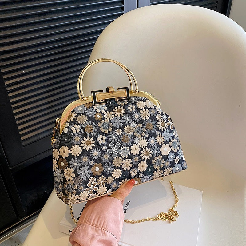 Damen elegante Umhängetasche mit floralen Akzenten und goldenen Verzierungen Nord Taschen