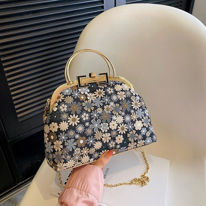 Damen elegante Umhängetasche mit floralen Akzenten und goldenen Verzierungen Nord Taschen