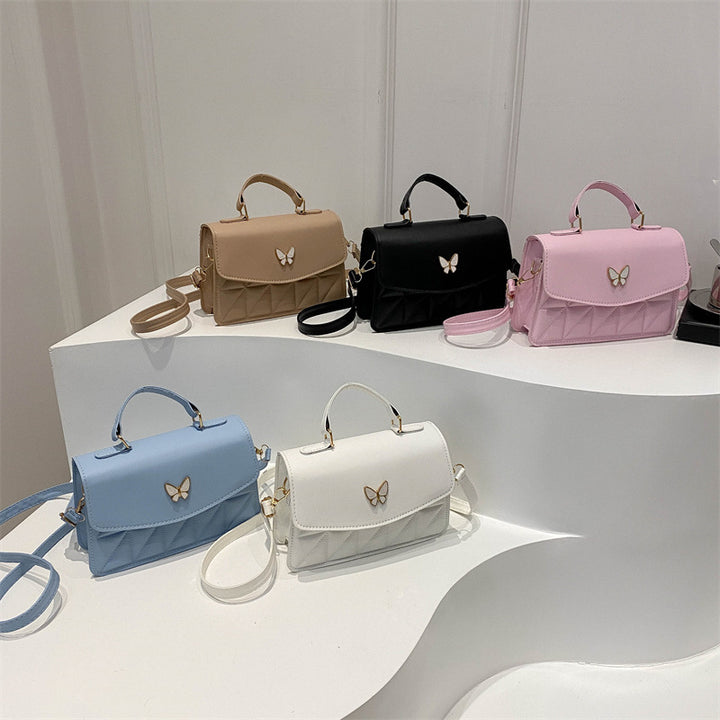 Damen elegante Handtasche mit Quermuster und stylischem Schmetterling Nord Taschen