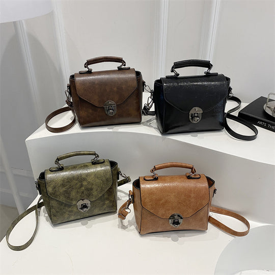 Damen Umhängetasche aus hochwertigem Kunstleder mit innovativem Klappverschluss Nord Taschen