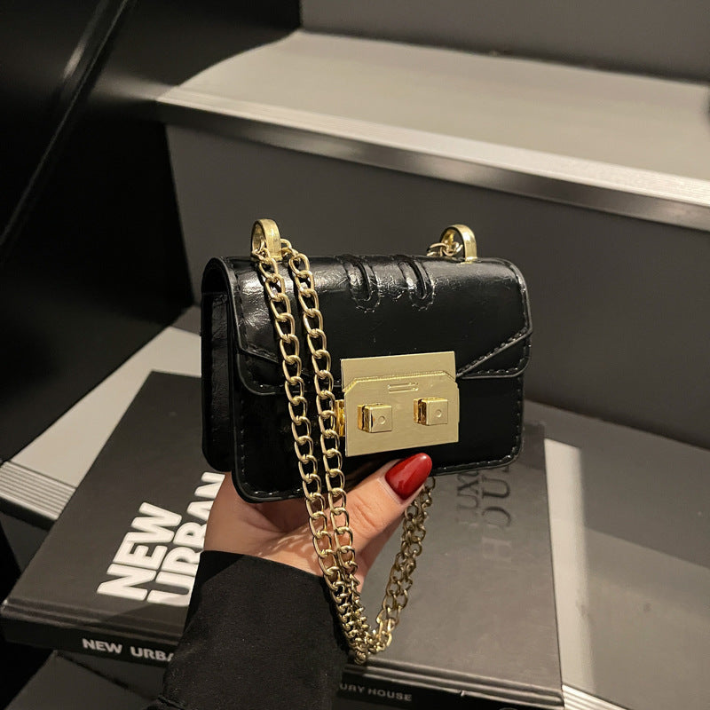 Damen elegante Mini-Handtasche mit goldener Verschlussmechanik Nord Taschen