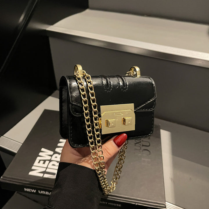 Damen elegante Mini-Handtasche mit goldener Verschlussmechanik Nord Taschen