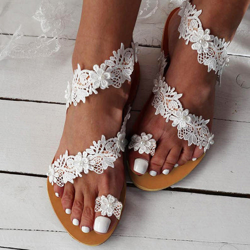 Damen Elegante und zarte Riemchen-Sandalen mit floralen Details