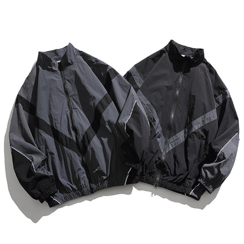 [Unisex] Oversize technische Wind- und Regenjacke mit Stehkragen, reflektierenden Paspeln und elastischem Saum Nord Taschen