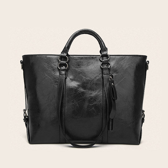 Damen Handtasche aus hochwertigem Kunstleder mit abgepolsterten Tragegriffen und abnehmbarem Schulterriemen Nord Taschen