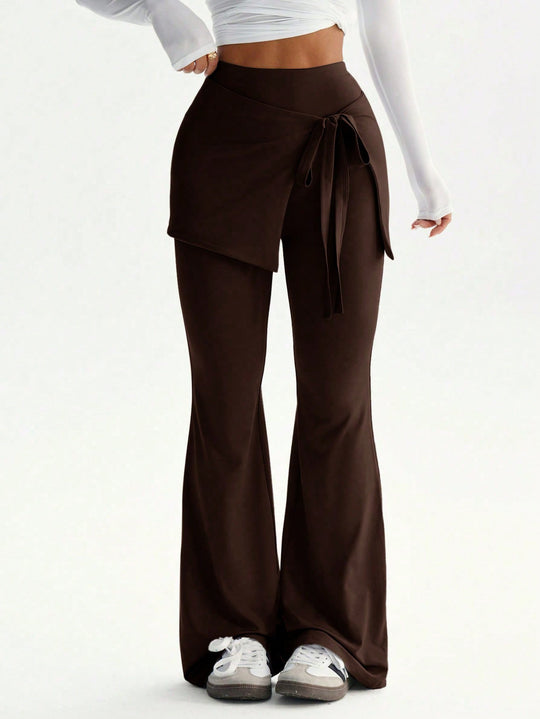 Damen hochtaillierte Schlaghose mit Wickelrock-Overlay und Taillenschleife Nord Taschen