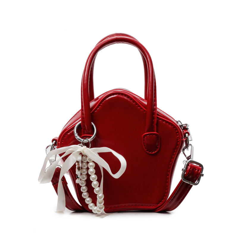 Damen modische Handtasche mit verspieltem Anhänger Nord Taschen