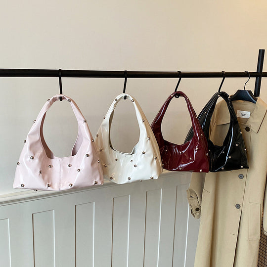 Damen glänzende Handtasche mit strukturiertem Design Nord Taschen
