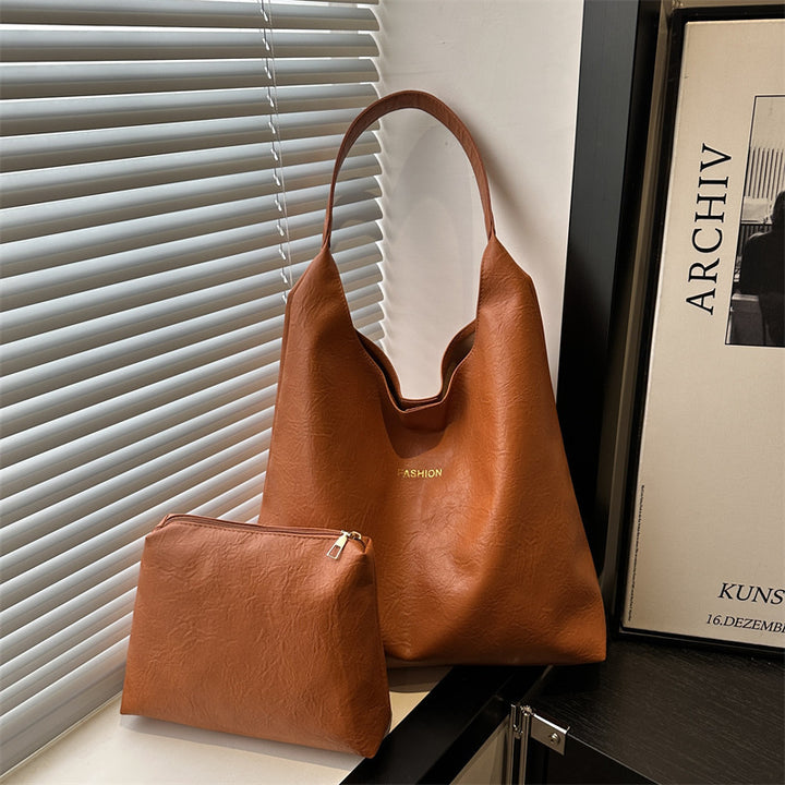 Damen elegante Umhängetasche aus kunstleder mit einer passenden Kosmetiktasche Nord Taschen