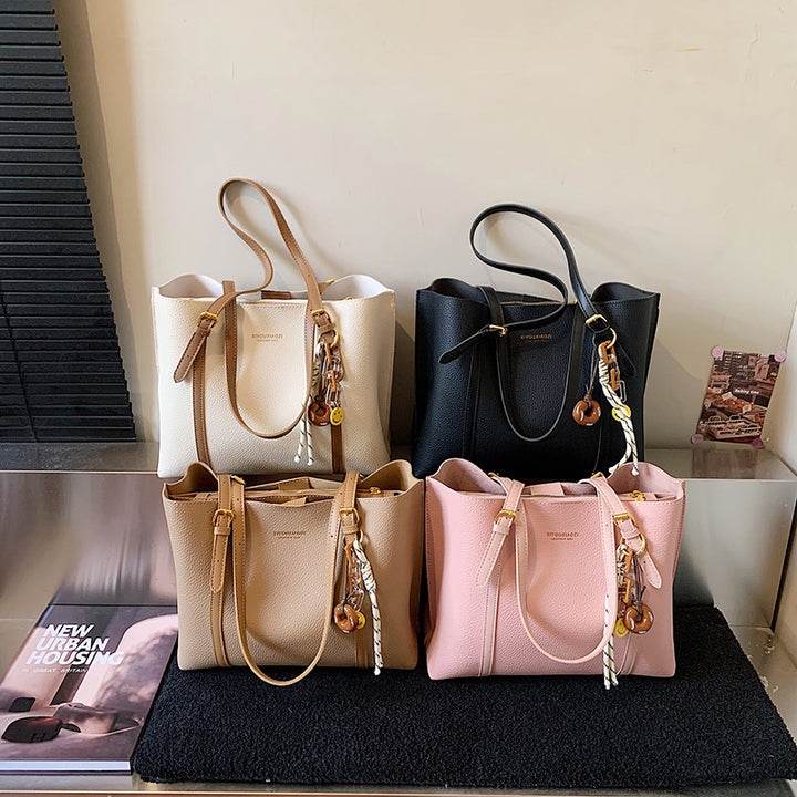 Damen elegante Handtasche im minimalistischen Stil mit einzigartigem Anhänger Nord Taschen