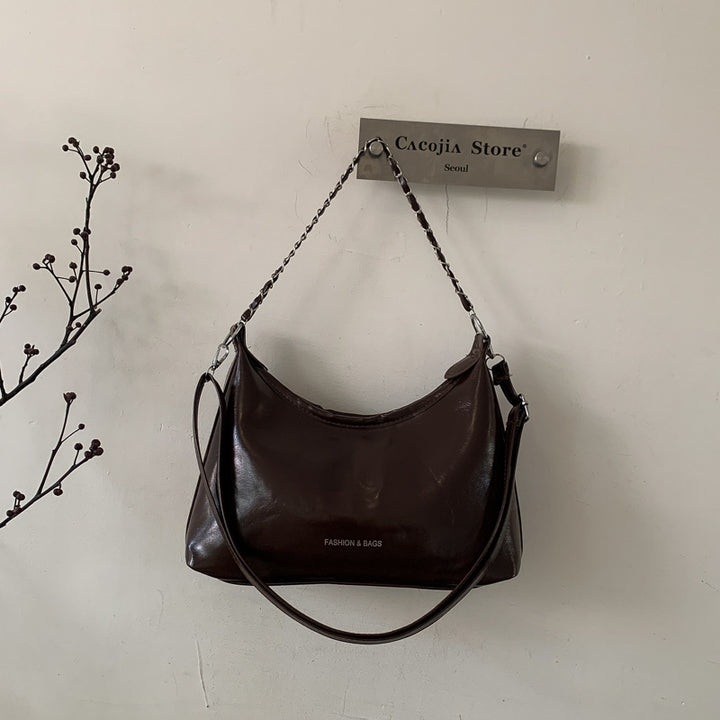 Damen Umhängetasche mit luxuriösem, poliertem Kunstleder und vielseitigem Tragegurt Nord Taschen