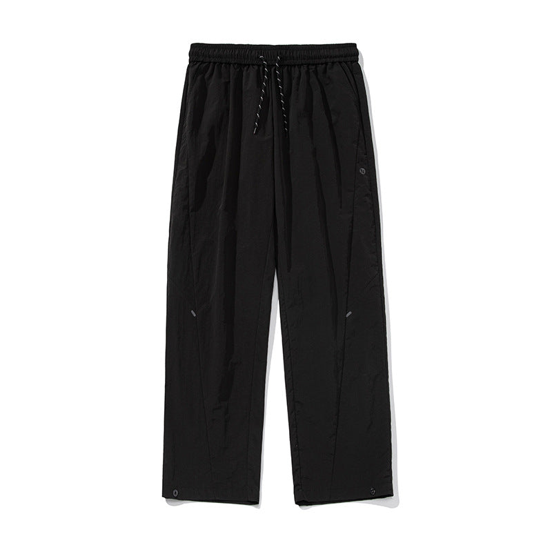 Unisex Weite wasserabweisende Nylon-Freizeithose mit elastischem Bund und Druckknopf-Saum Nord Taschen