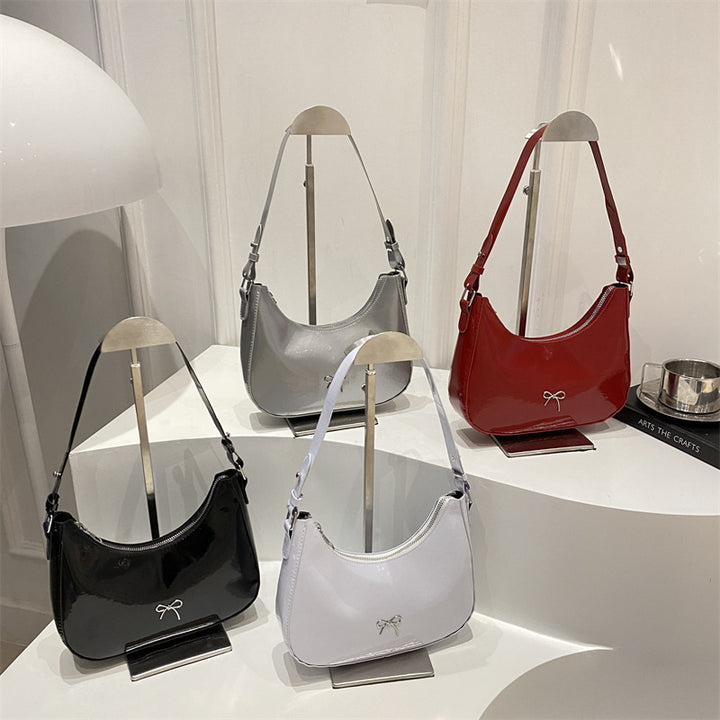 Damen Hobo-Tasche aus glänzendem Kunstleder mit dekorativem Schleifendetail Nord Taschen