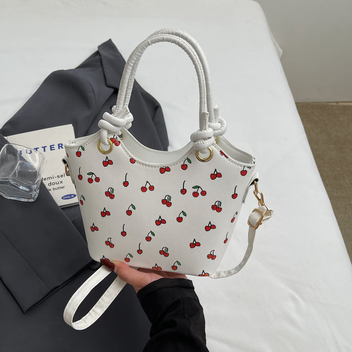 Damen Handtasche mit charmantem Kirschdesign und eleganten Details Nord Taschen