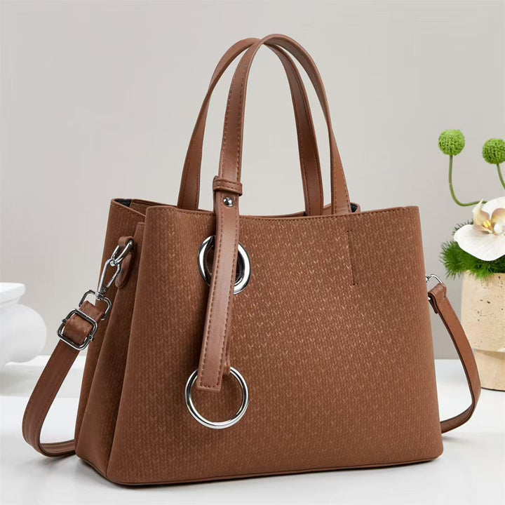 Damen Handtasche mit strukturiertem Design und eleganten Ringdetails Nord Taschen